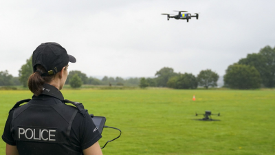 Police officer flying a drone